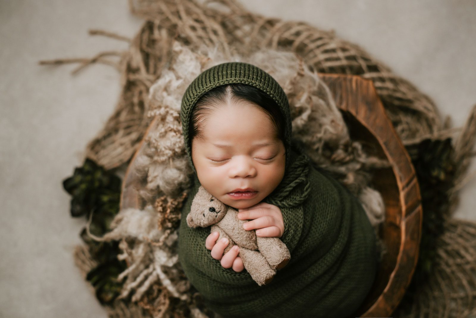 Newborn Baby Sleeping Peacefully During A Professional Portrait Session
