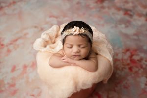 Newborn Posed In A Bucket Coral Theme