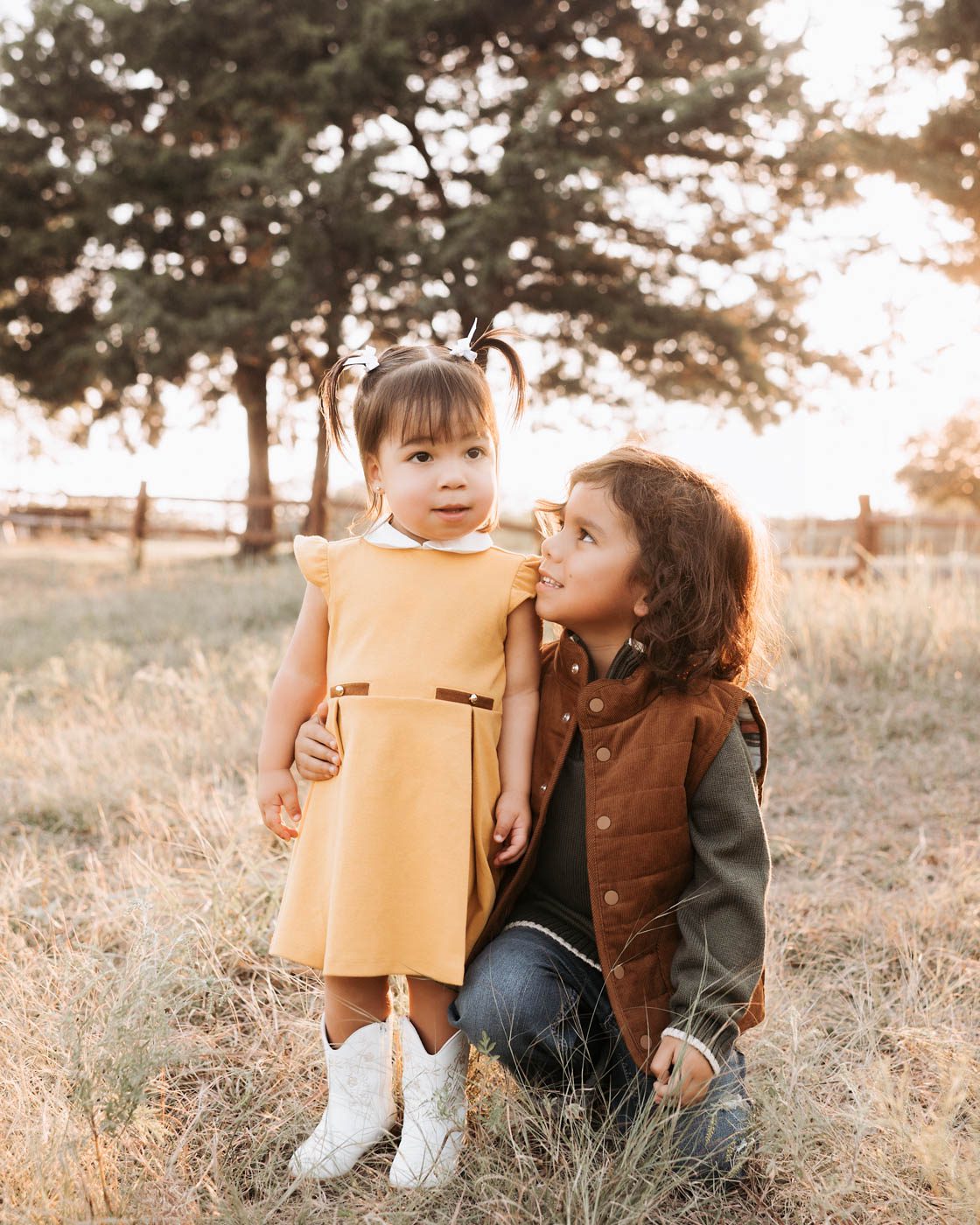 Children Dressed In Coordinated Outfits During An Outdoor Family Photography Session