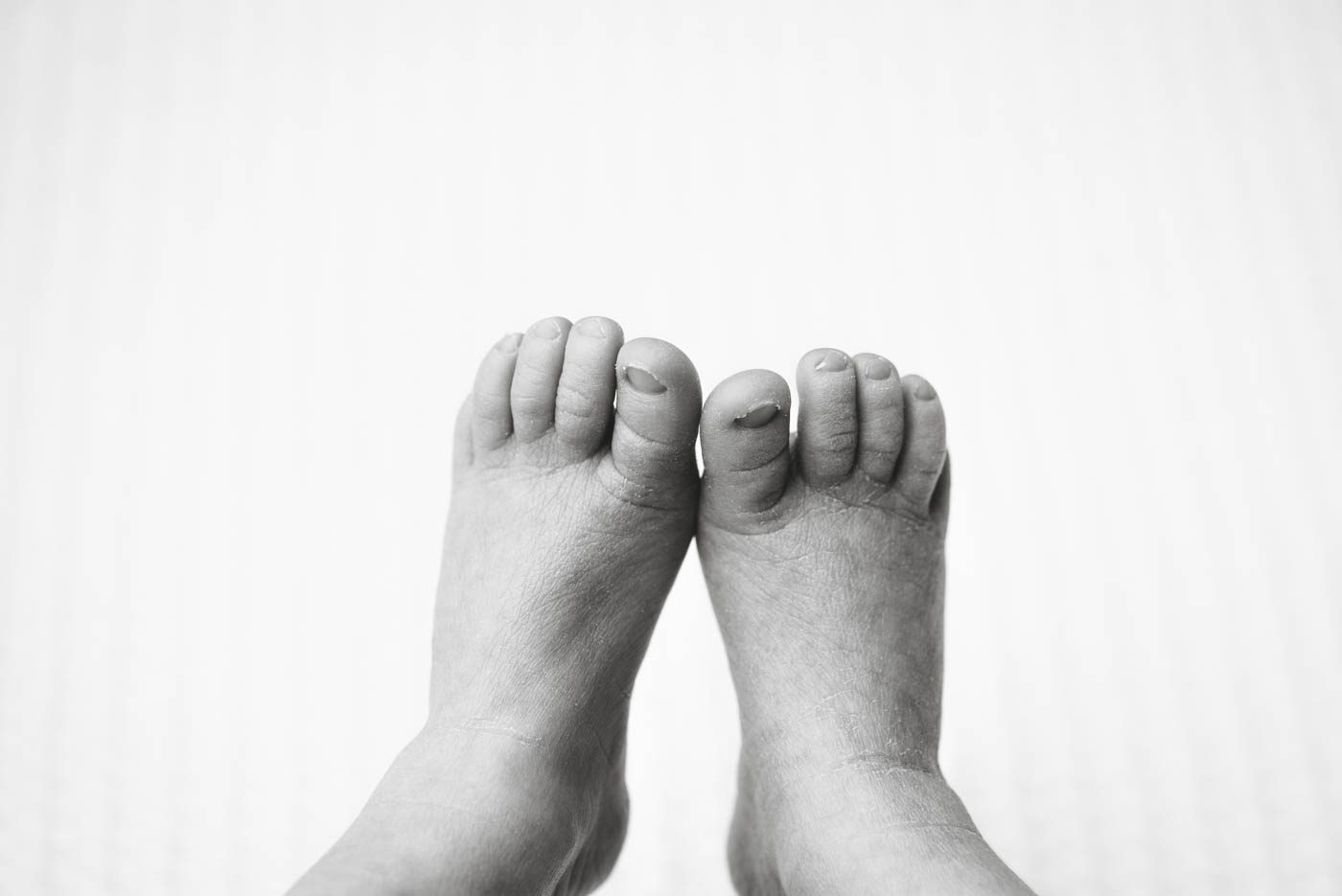 Close-Up Photograph Of Newborn Baby Feet During A Newborn Photography Session