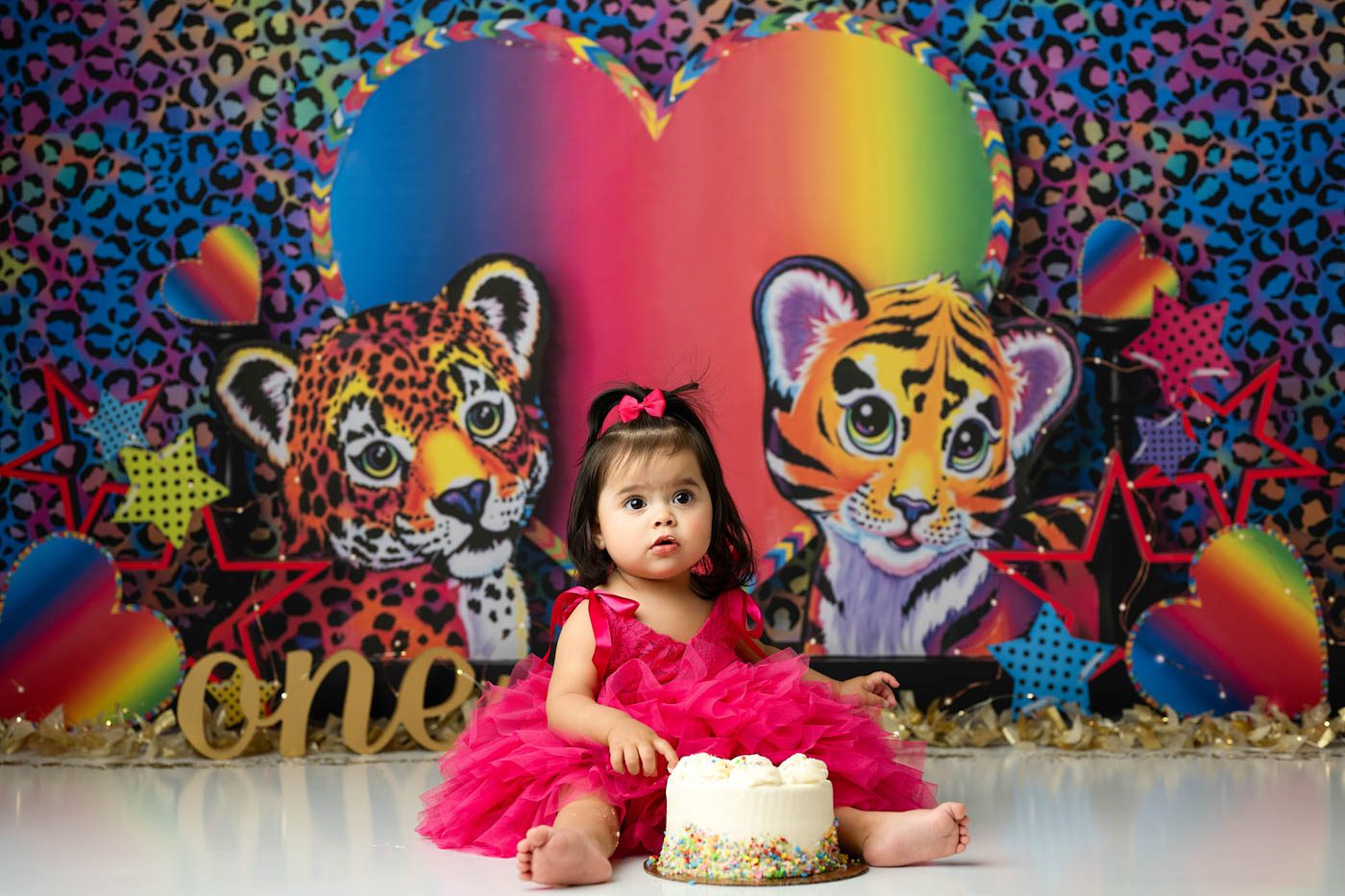Colorful Cake Smash Photography In Dallas Setup Featuring A Unique First Birthday Theme