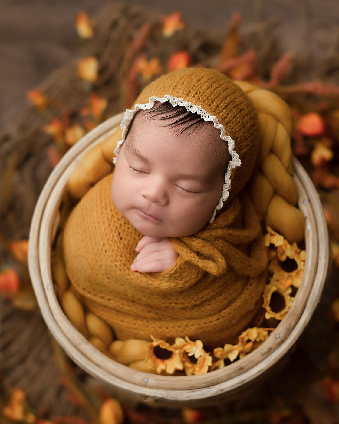 Newborn Baby Peacefully Sleeping During A Professionally Styled Portrait Session