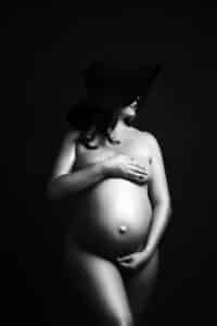 Pregnant Woman With A Hat For Pricing For Maternity Photography In Dallas With Maternity Photographer | Lily Hayes Photography