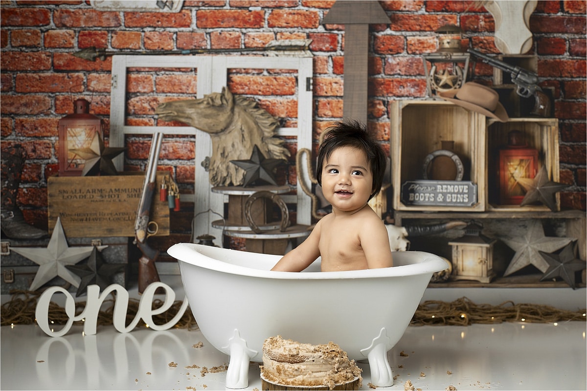 Baby In A Bathtub Smiling During A Ranch Themed Cake Smash Photoshoot