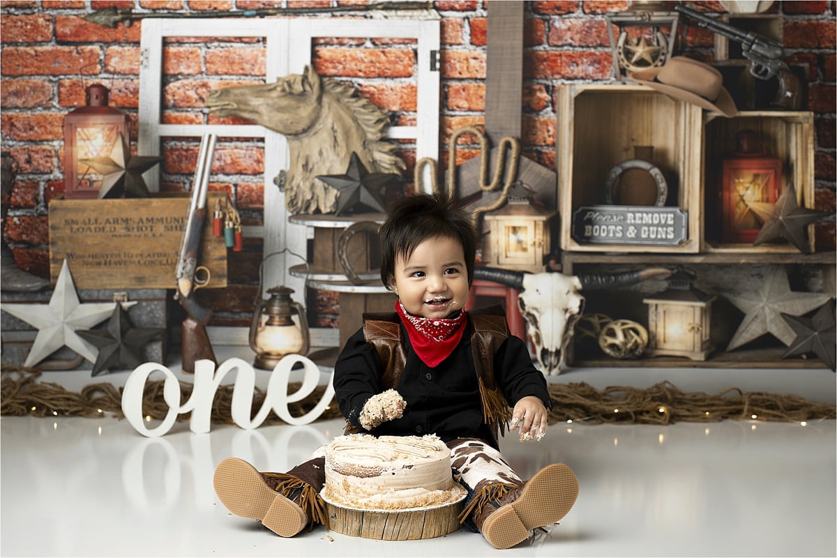 Baby Eating Cake For A Rancher Themed Cake Smash Photoshoot 