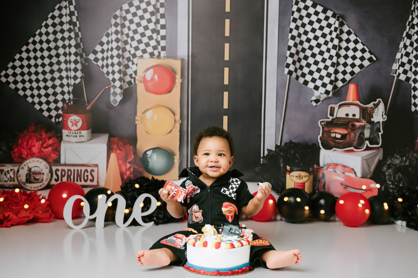 Creative Cake Smash Ideas For Your Baby’s First Birthday 2 Race Car Themed Cake Smash Setup With Bold Colors And Playful First Birthday Styling