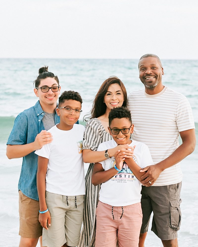 family of 5 on the beach for a family photoshoot