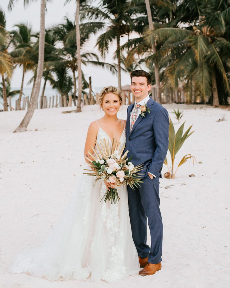couple posing on beach for dallas wedding photographer