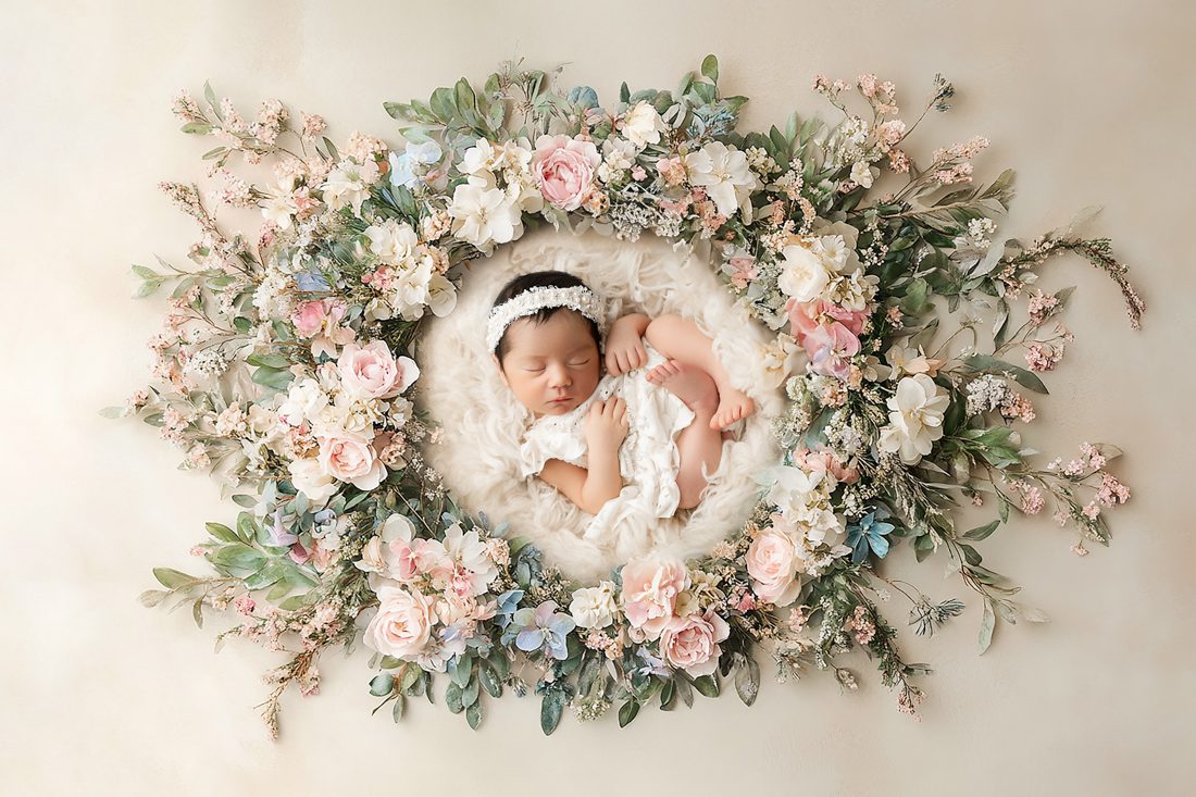 newborn photos of baby sleeping surrounded by floral by dallas newborn photographer