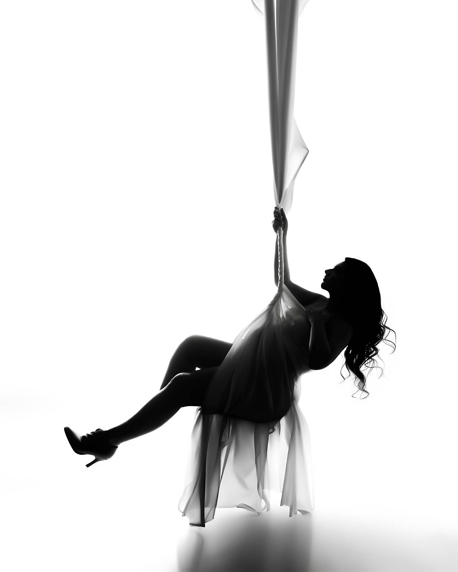 Artistic silhouette maternity portrait of an expecting mother in Dallas captured by Lily Hayes Photography