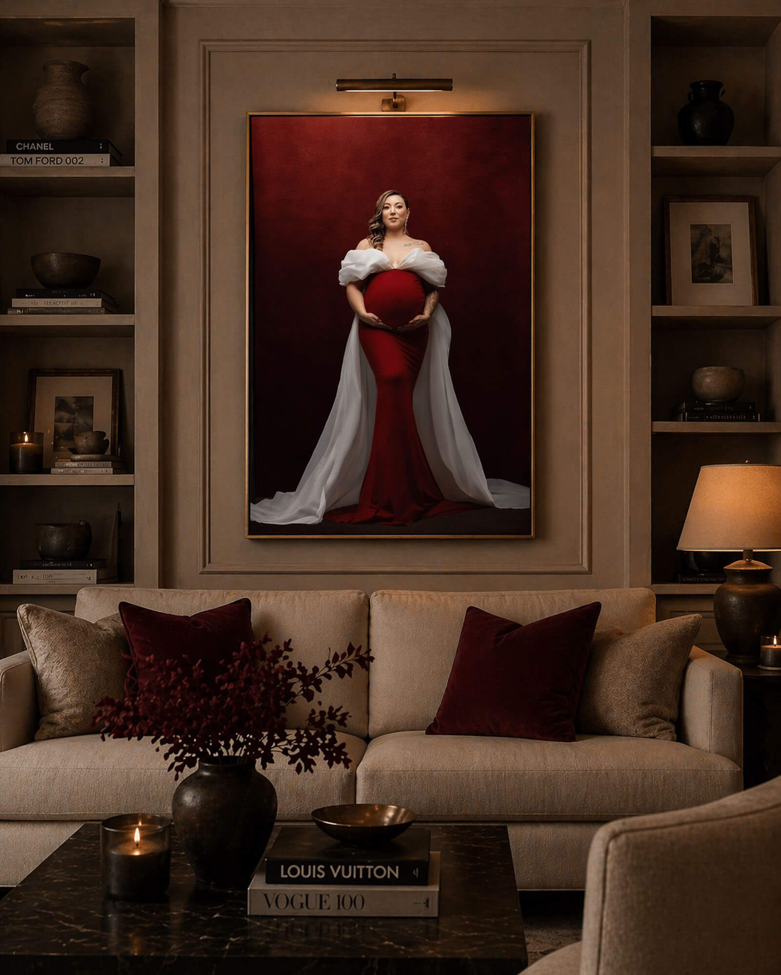 Luxury Dallas maternity photography displayed as framed wall art in an elegant living room featuring a red gown studio portrait