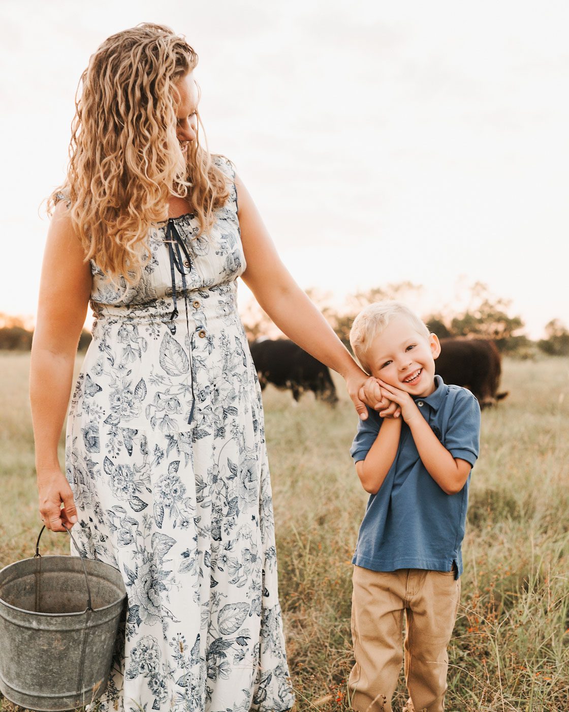 Mother and young son sharing a joyful moment together during an outdoor portrait session