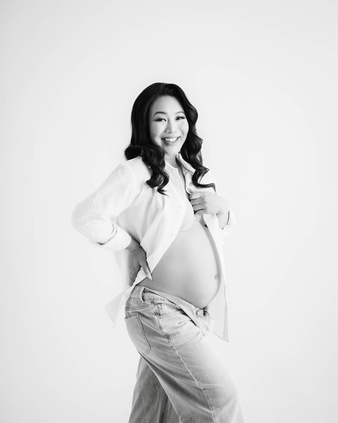 Couple Sharing A Candid Moment During Studio Maternity Photography Session In Dallas