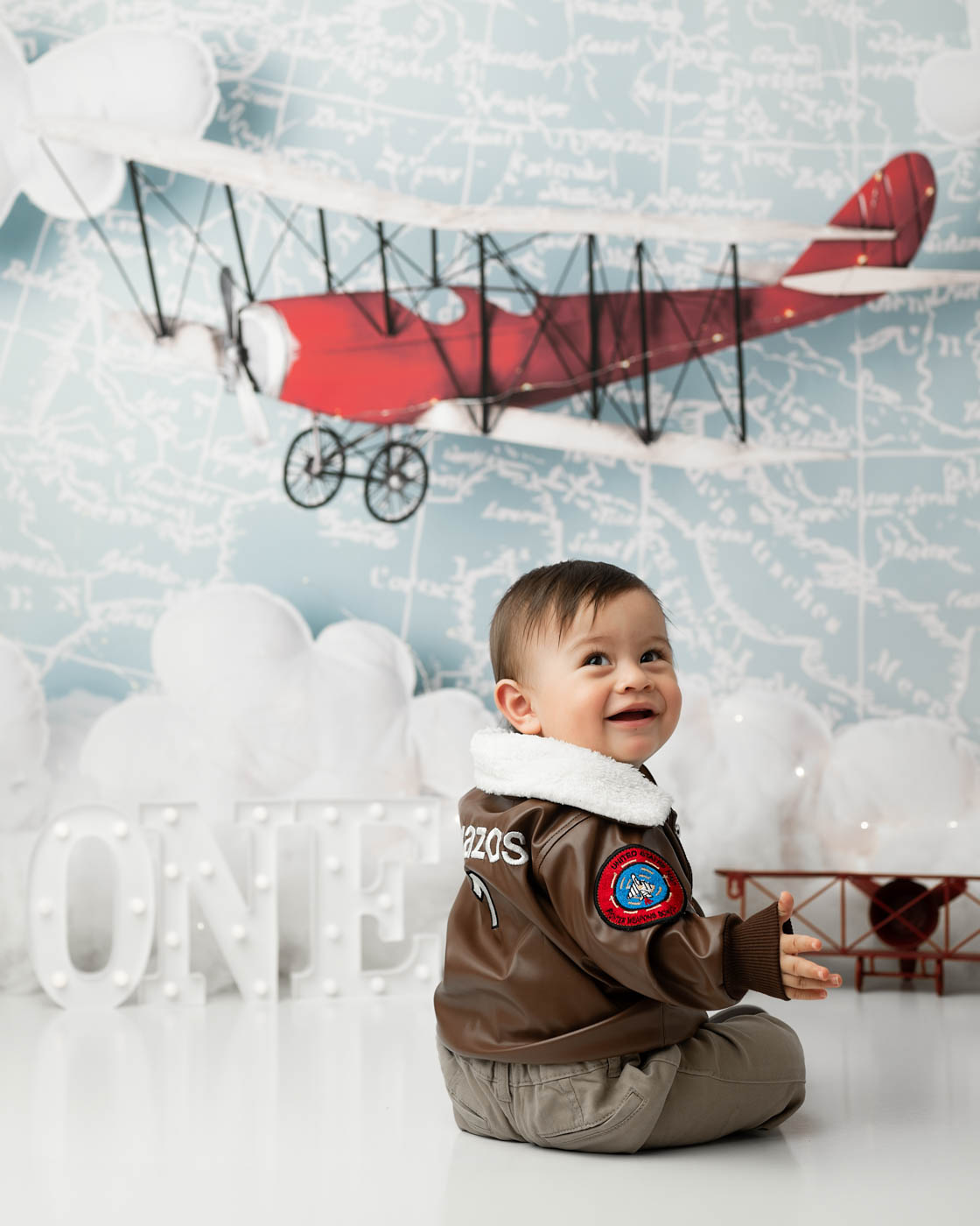 Side Profile Of A One-Year-Old During An Airplane-Themed First Birthday Photography Session
