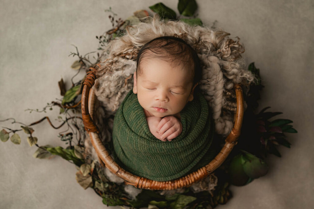 Dallas Newborn Photographer Demonstrating A Safe Wrapped Newborn Pose