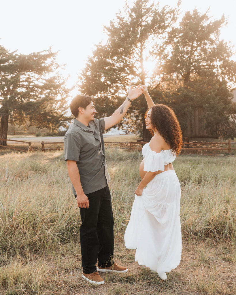 Expecting Couple During A Dallas Maternity Photoshoot In An Outdoor Setting At Sunset
