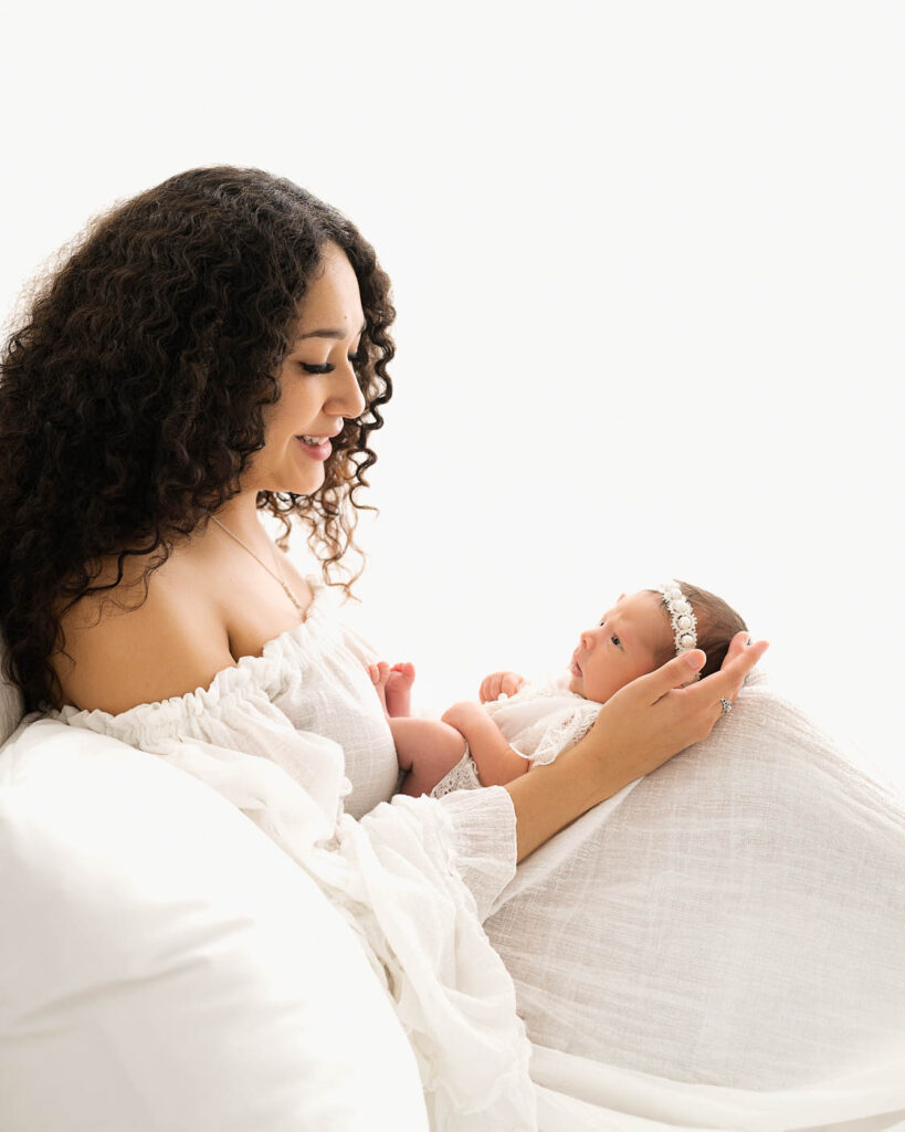Mother Holding An Alert Baby During An Older Newborn Photography Session In Dallas