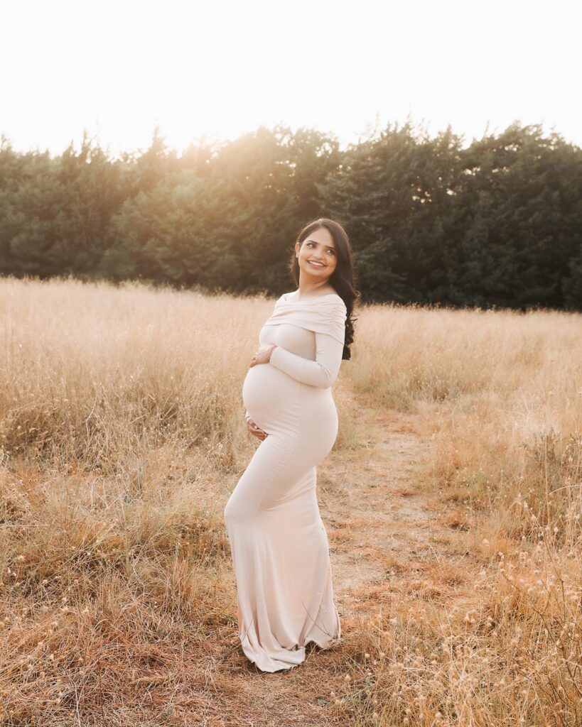 Dallas Maternity Photography Featuring Flattering Side Posing That Highlights The Shape Of The Baby Bump Outdoors.