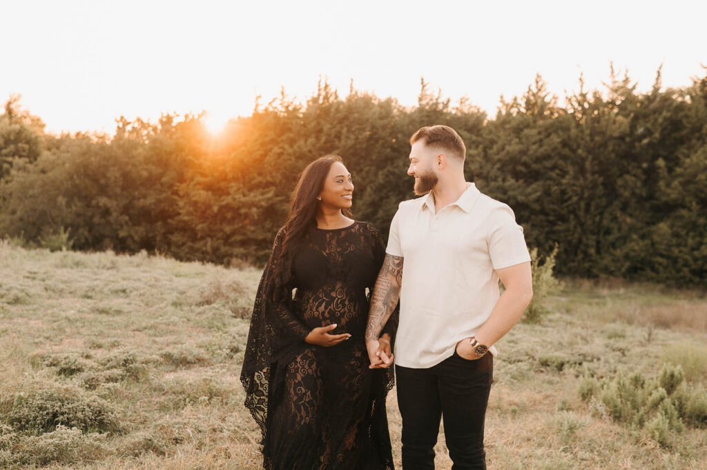 Should Your Partner Be Included In Your Maternity Photos? 6 Dallas Maternity Photographer Portrait Of Expecting Mother In A White Gown Standing With Her Partner Outdoors