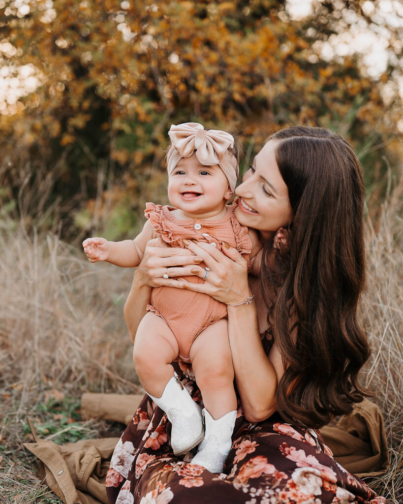 How A Dallas Family Photographer Works With Young Kids Who Don’t Want To Sit Still 1 Mom Holding Her Baby During An Outdoor Dallas Family Photography Session.