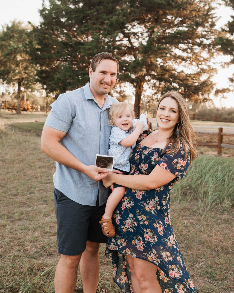 Maternity Photos With A Toddler: What Actually Works 3 Pregnant Mom, Dad, And Toddler Posing Together During A Dallas Maternity Photo Session.