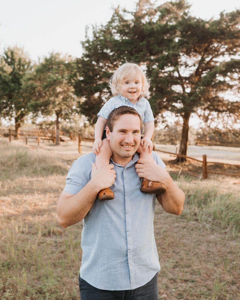 Maternity Photos With A Toddler: What Actually Works 2 Dad Holding His Toddler During A Dallas Family Maternity Photography Session.