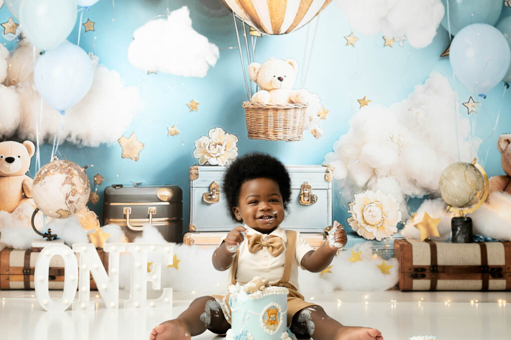 Baby Moving Around The Cake Setup During A Dallas Cake Smash Photography Session.