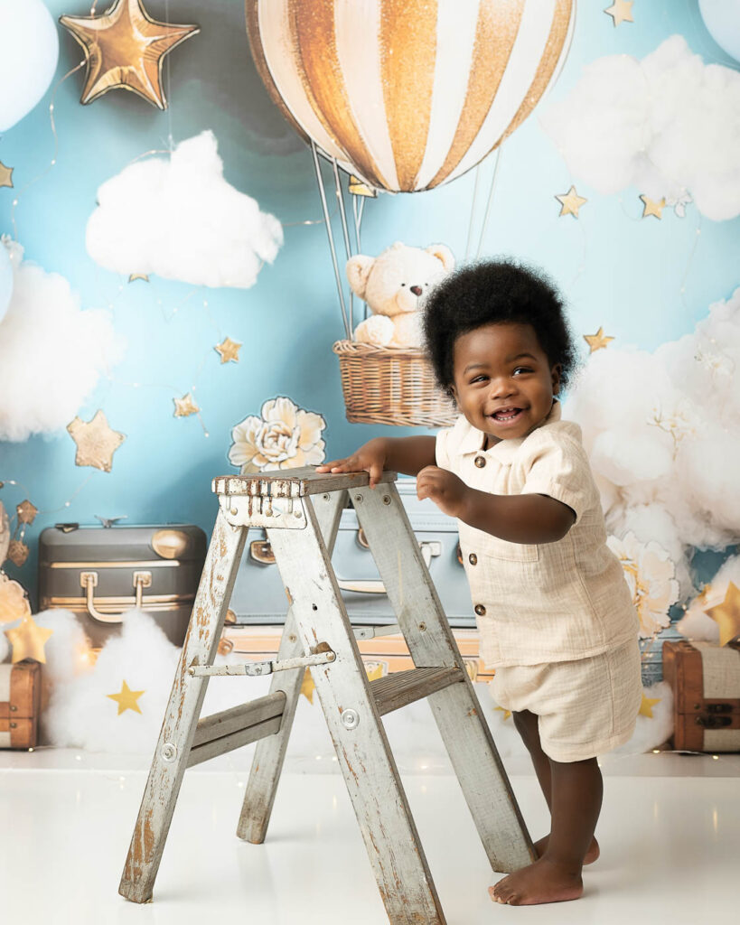 One-Year-Old Standing Beside The Cake During A Dallas Cake Smash Session.