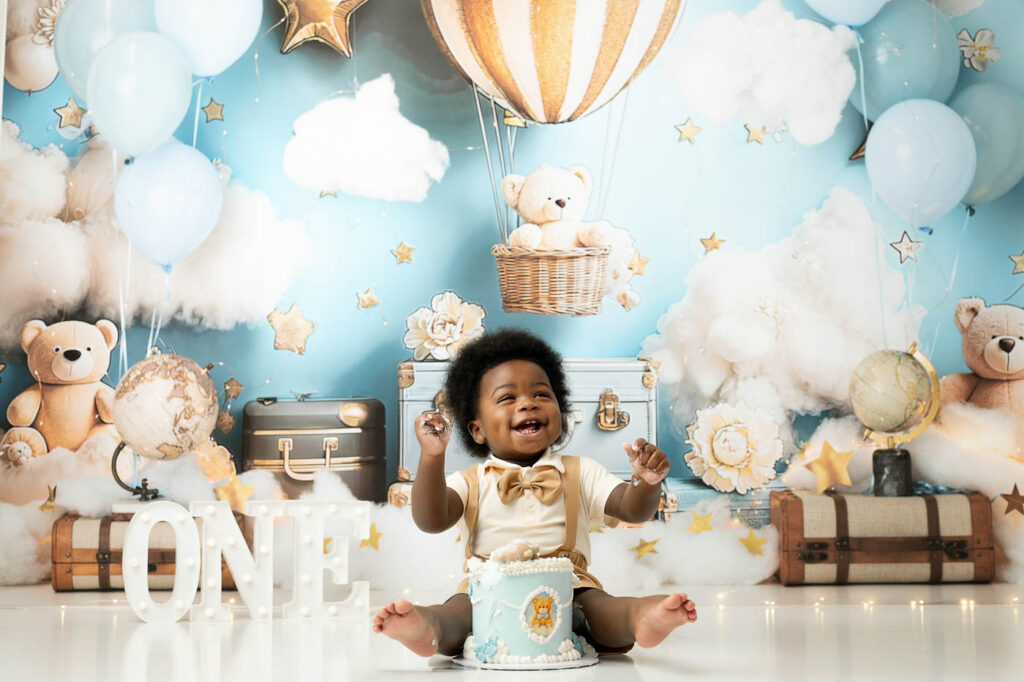 Active One-Year-Old Sitting With His Cake During A Dallas Cake Smash Session.