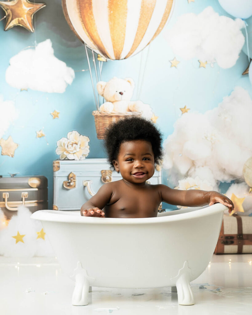 Baby Sitting In A Small Tub During The Optional Splash Bath After A Dallas Cake Smash Session.