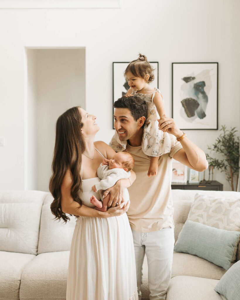 Dallas Lifestyle Newborn Photography Featuring Parents With Their Newborn Baby Boy And Toddler Daughter In A Softly Styled Studio